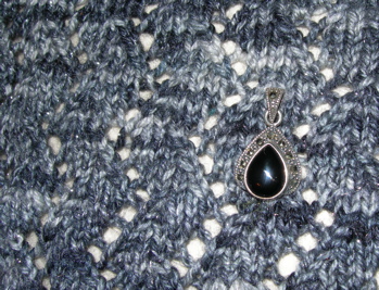 Marcasite yarn, marcasite and onyx pendant.